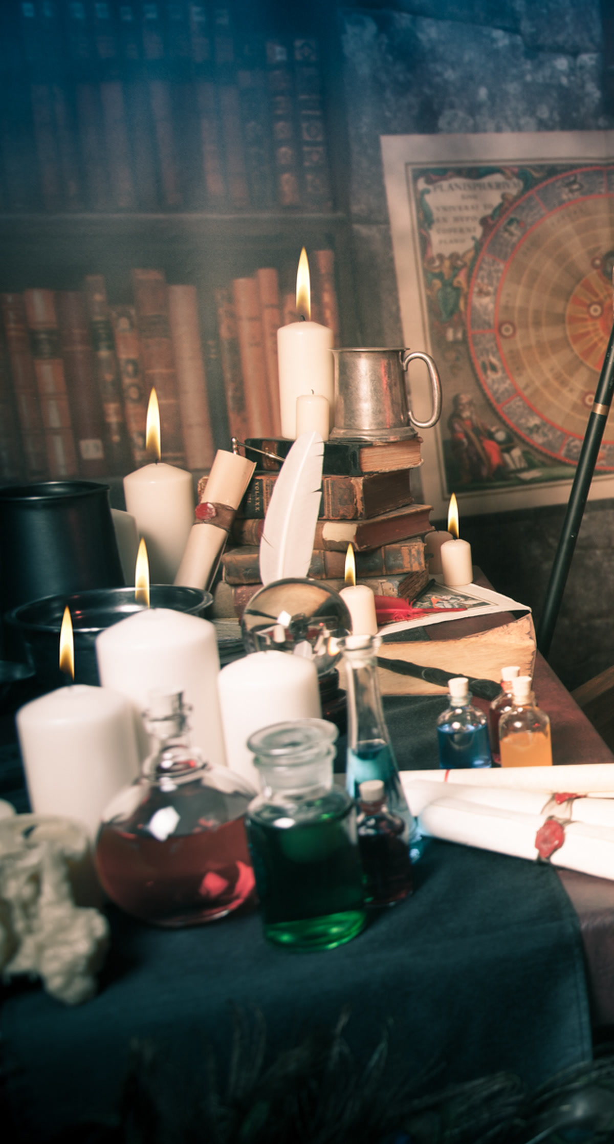 Hand-dressed set detail with candles, flasks and scrolls